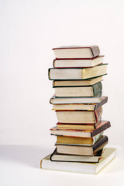 Stack of old books on white background - Foto, imagen