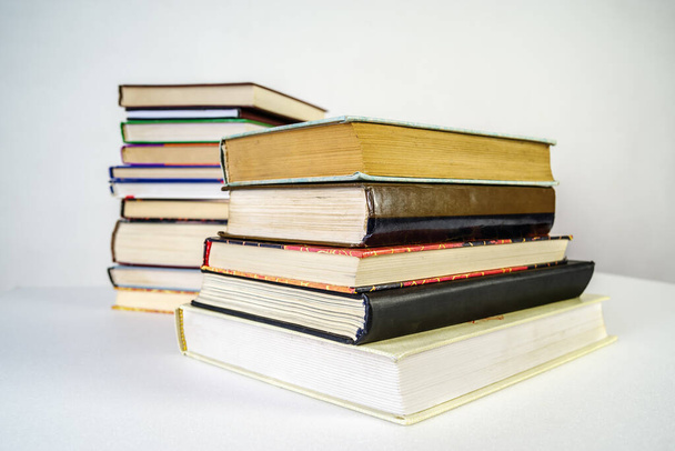 Stack of old books on white background - Photo, image