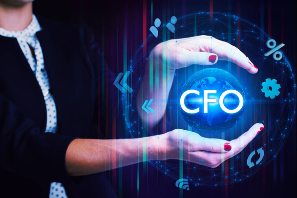 Business, Technology, Internet and network concept. Young businessman working on a virtual screen of the future and sees the inscription: CFO - Foto, imagen