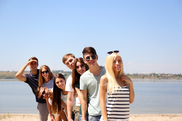 Group of friends at beach - Фото, зображення