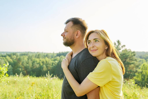 Portrait of happy middle-aged couple on summer sunny day - Photo, Image