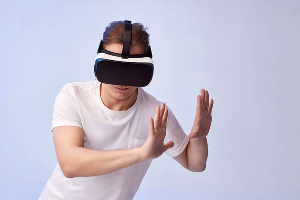 Young man using virtual reality headset. VR gadgets - Foto, afbeelding