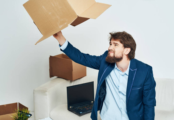 business man in the office unpacking things  - Foto, Imagem