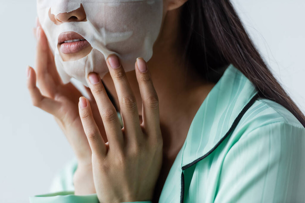 partial view of woman applying facial mask at home - 写真・画像