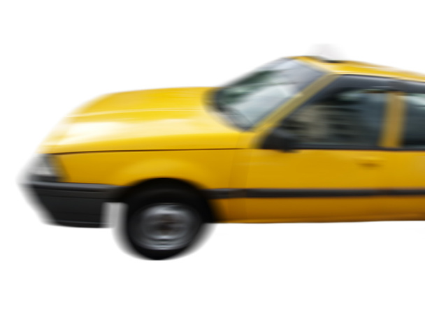 Panning picture of a yellow cab isolated on white - Photo, Image