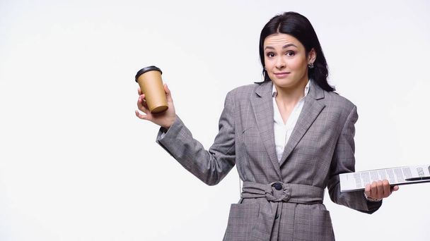 Confused businesswoman with clipboard and paper cup isolated on white - Photo, Image
