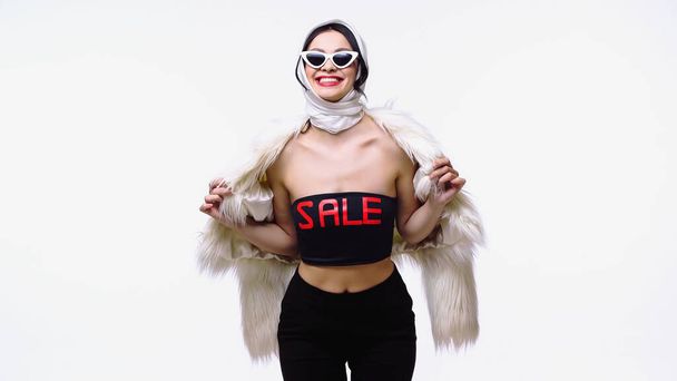 Stylish woman in fluffy jacket and top with sale lettering isolated on white - Φωτογραφία, εικόνα