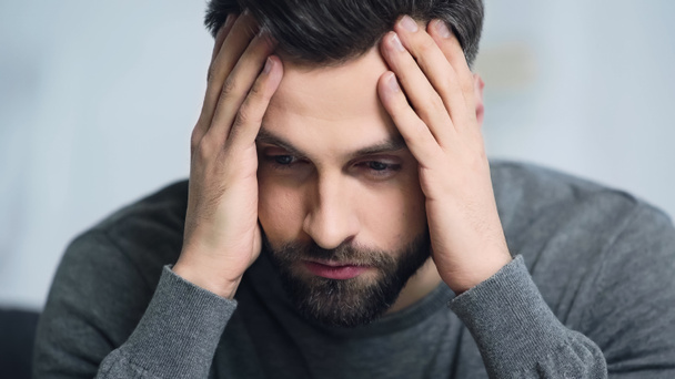 dissatisfied and bearded man touching forehead with hands - Photo, Image