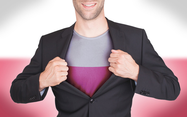 επιχειρηματίας άνοιγμα κοστούμι να αποκαλύψει πουκάμισο με σημαία - Φωτογραφία, εικόνα