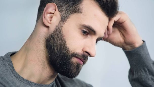 pensive and sad man touching forehead with hand - Photo, Image