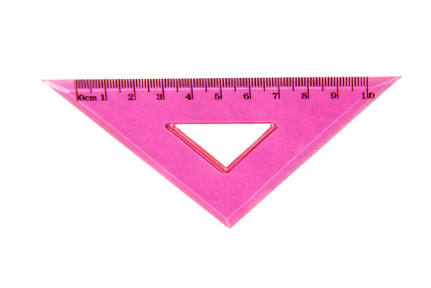 school supplies, stationery, pink triangular ruler, close up, isolated with clipping path on white background. template back to school - Photo, Image
