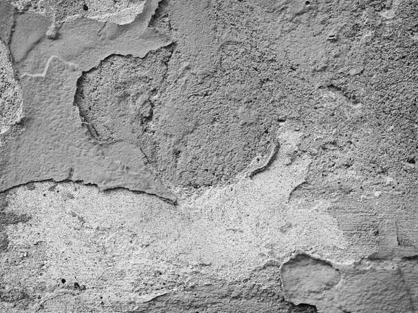 Getextureerde witte cement muur met geruïneerd grungy gips template achtergrond afbeelding - Foto, afbeelding