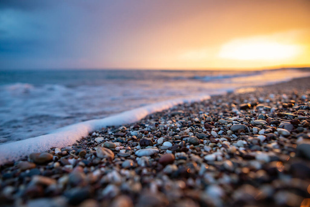 sea coast at sunset with stones - Foto, Imagem