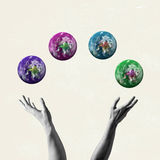 Contemporary artwork. Human bw hands holding four colored images of the Earth. Concept of saving nature. - Photo, Image