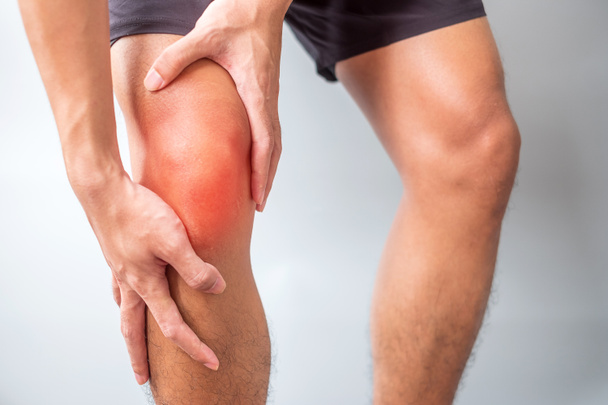 man with muscle pain on grey background. Elderly have knee ache due to Runners Knee or Patellofemoral Pain Syndrome, osteoarthritis, arthritis, rheumatism and Patellar Tendinitis. medical concept - Фото, зображення