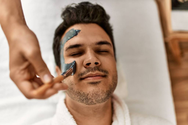 Man reciving facial treatment at beauty center. - Foto, immagini