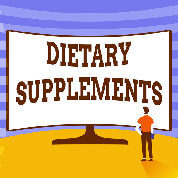 Text sign showing Dietary Supplements. Word Written on Product taken orally intended to supplement ones diet Man Standing Illustration Standing Infront Of Huge Display Screen. - Photo, Image