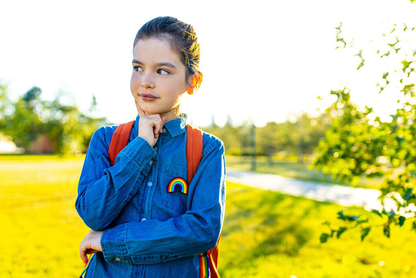 preteen latin kid schoolgirl student wears uniform and backpack outdoors - Фото, зображення