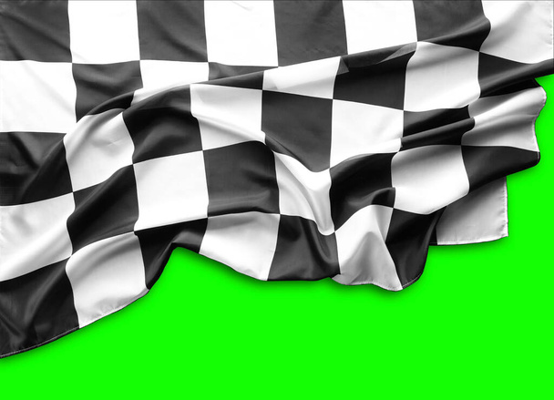 Karierte schwarz-weiße Flagge auf grünem Hintergrund - Foto, Bild