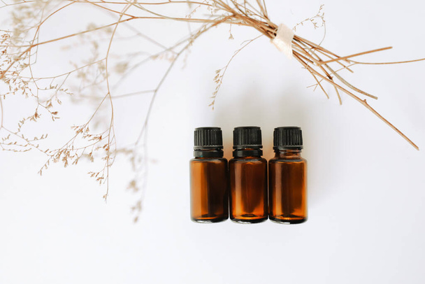 A closeup shot of three 1ml amber essential oil vials - Foto, afbeelding
