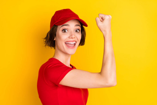 Profile photo of nice hooray brown hair lady fist wear t-shirt isolated on yellow color background - Foto, Imagem