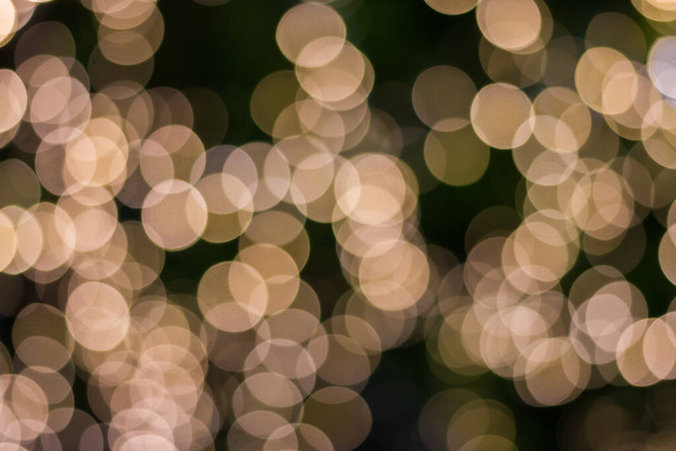 Gold color bokeh elegant abstract background with bokeh defocused lights - Photo, Image