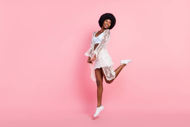 Full length body size photo girl wearing white cape jumping high pretty dreamy happy isolated pastel pink color background - Φωτογραφία, εικόνα