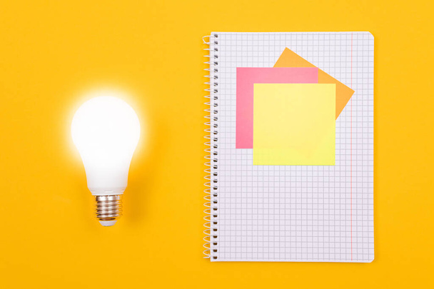 Glowing Power Saving Lamp and A Notepad with Sticky Notes - 写真・画像