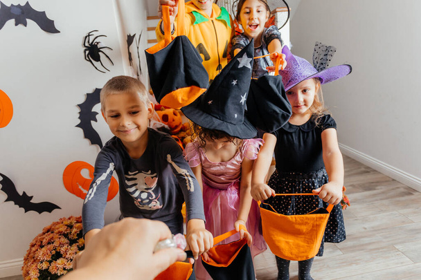 Group of kids waiting for Halloween candies - Foto, imagen