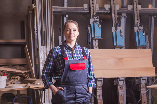 Self-confident woman engineer at woodworking plant indoor - Fotoğraf, Görsel