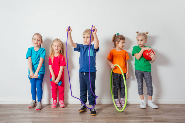 Young children adore doing physical activities at preschool - Foto, Imagen