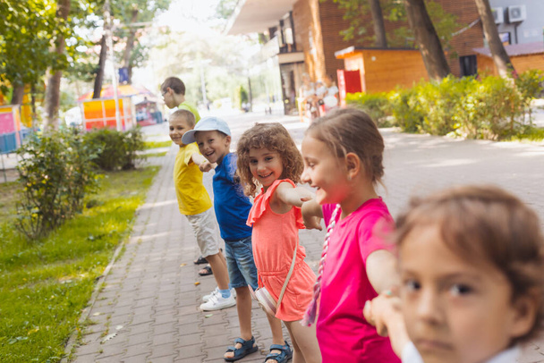 Lovely children playing outdoors at summer camp - Foto, immagini