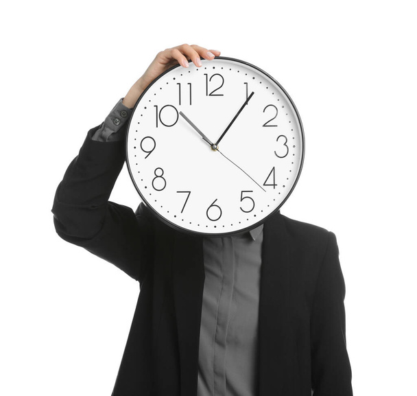 Businesswoman holding clock on white background. Time management - Fotoğraf, Görsel