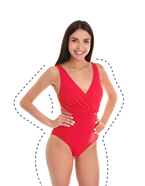 Young slim woman in swimsuit after weight loss on white background. Healthy diet - Valokuva, kuva