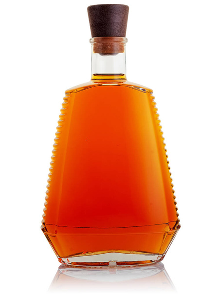 A bottle with a strong alcoholic drink on a white background - Fotoğraf, Görsel