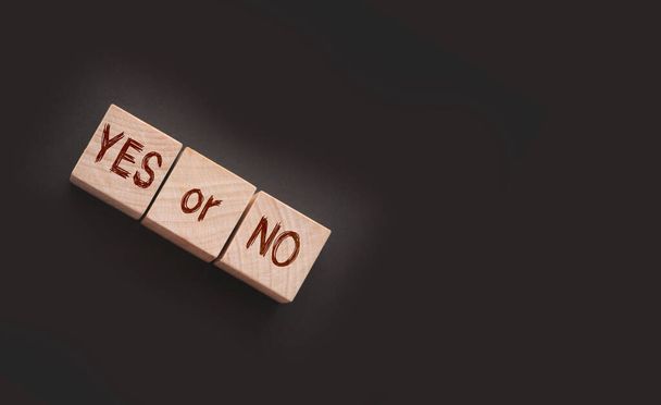 Words YES or NO on wooden blocks. Business and career, education choice concept. - Foto, afbeelding