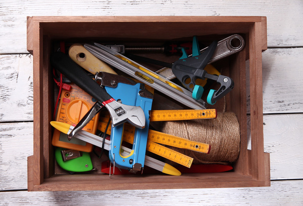 Wooden box with different tools - Foto, afbeelding