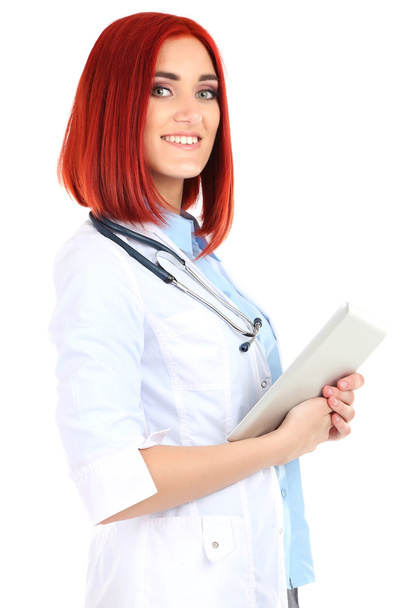 Young beautiful doctor holding tablet isolated on white - Foto, afbeelding