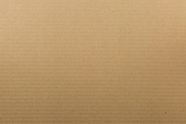 textura hnědého papíru pruhované užitečné jako pozadí - Fotografie, Obrázek