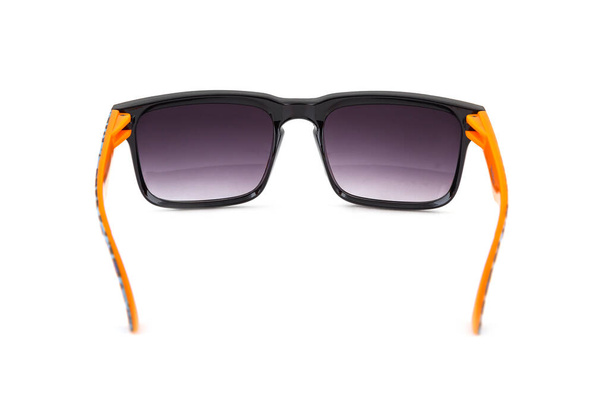 Black sunglasses with orange leg isolated on white background - Photo, Image