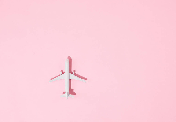 A toy airplane isolated on pink background - Photo, image