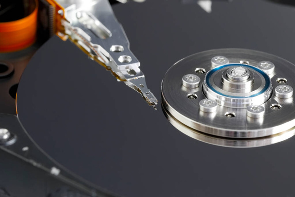 Head for writing and reading data on the ferromagnetic surface of the hard disk. The part of the computer that you see here is simply its memory for storing data. - Photo, Image