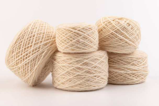 Ball of white wool yarn on white background. Knitting thread  - Foto, immagini