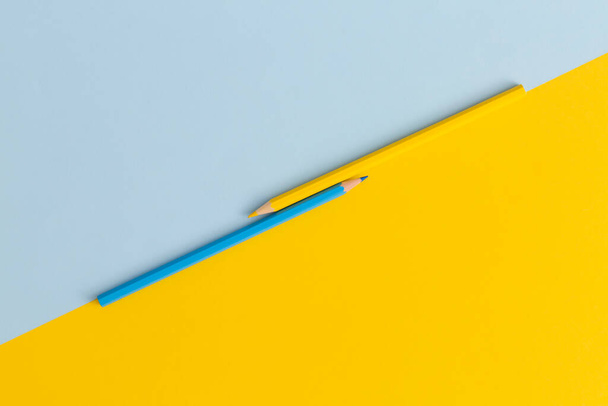 Colored pencils on yellow background. Top view with copy space. Flat lay. Back to school concept. - Fotografie, Obrázek