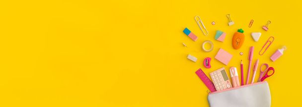 Pencil case with school stationery on a yellow background. Top view. Flat lay. Back to school concept. - Fotoğraf, Görsel