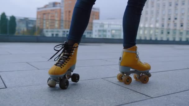 Unrecognizable girl making roller skating elements at rooftop in summer. - Footage, Video