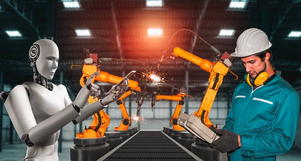 Robot industrial mecanizado y trabajador humano trabajando juntos en la futura fábrica - Foto, Imagen