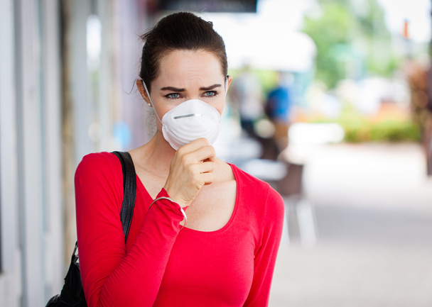 Woman wearing mask coughing - Photo, Image