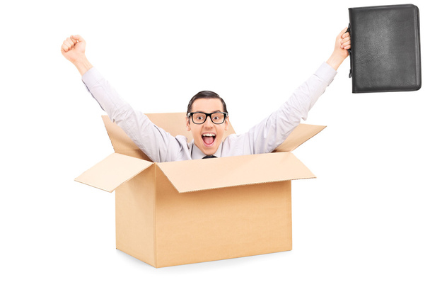 Businessman gesturing happiness inside box - Foto, Imagen