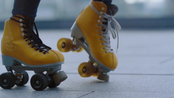 Unrecognizable girl performing moonwalk. Woman feet riding on rollerblades. - Footage, Video